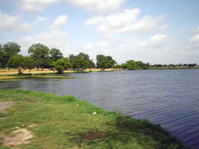 The shores of Victor Braunig Lake near San Antonio on a partially cloudy day.