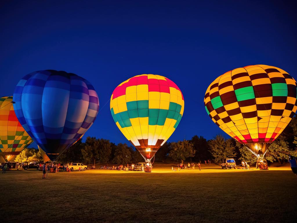 Shawnee, Oklahoma, USA with a night view of the Firelake Fireflight Balloon Festival event.