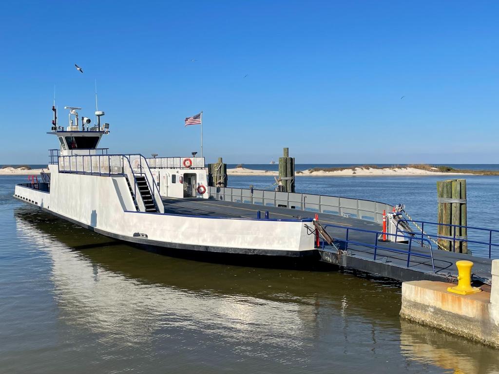 The empty vehicle ferry from Dauphin Island to Fort Morgan docked on a sunny day