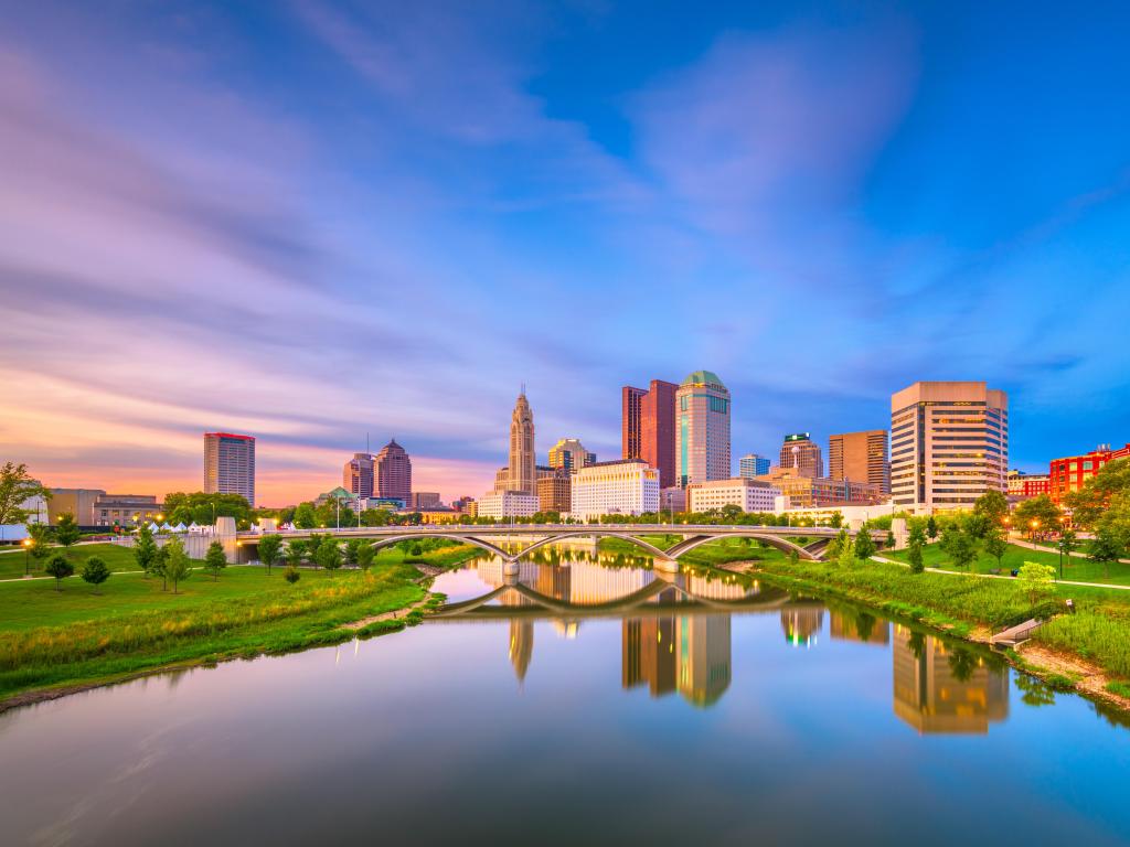 Columbus, Ohio, USA skyline on the river at dusk.