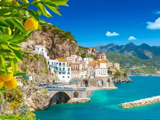 Beautiful view of Amalfi on the Mediterranean coast with lemons in the foreground, Italy