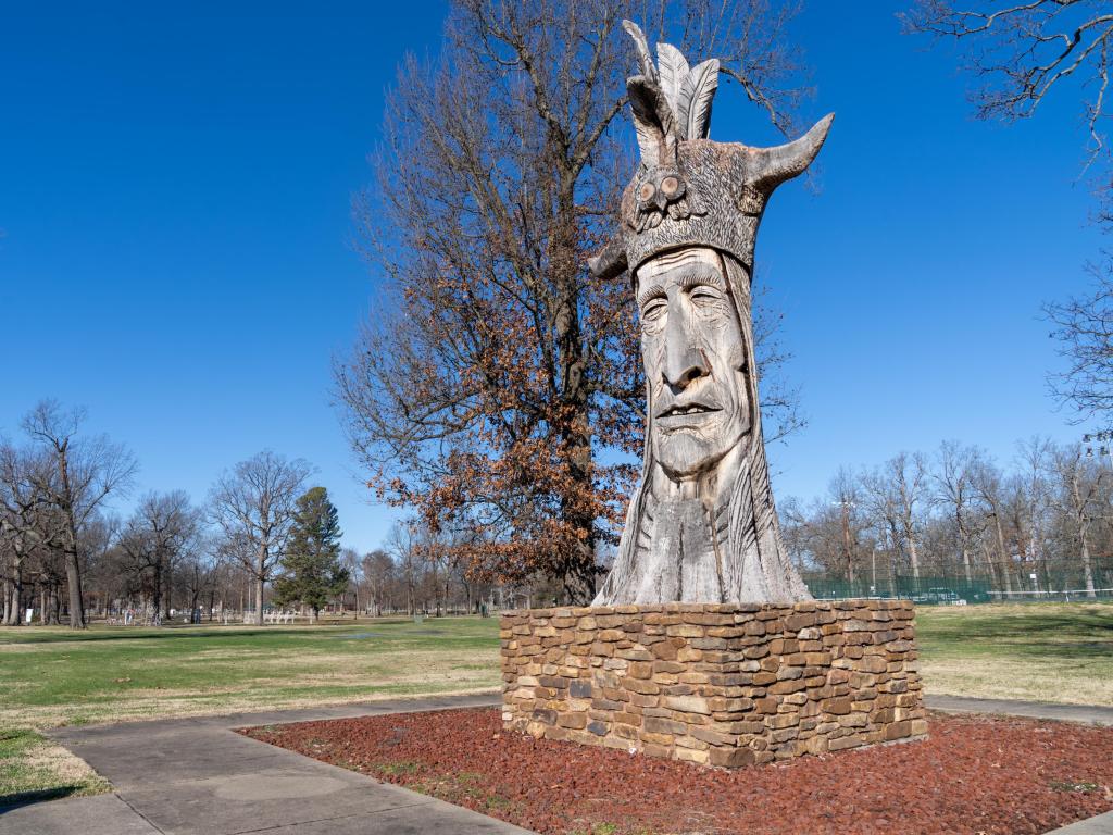 Trail of the Whispering Giants, A Native American sculpture in Bob Noble Park, photo taken during a sunny day with blue skies
