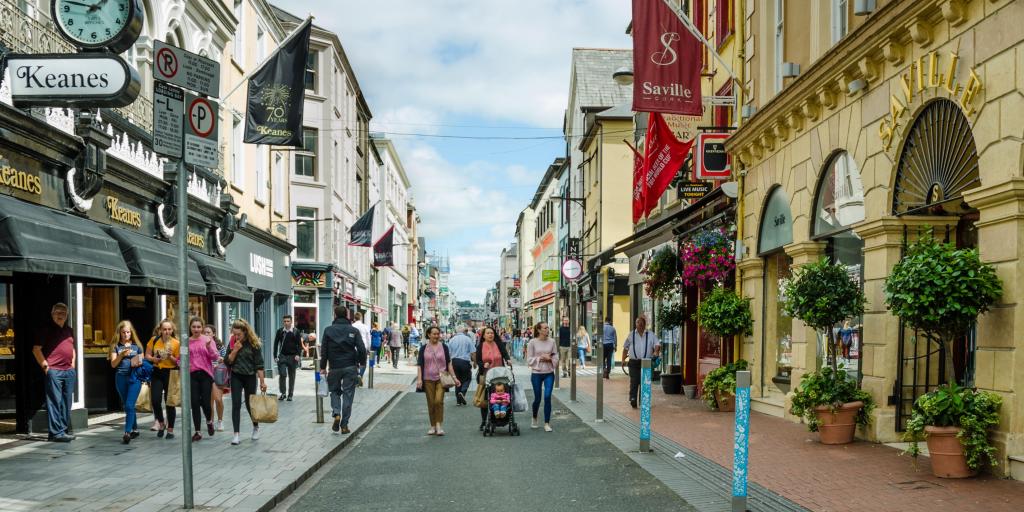 People walking down Oliver Plunkett Street in Cork, Ireland
