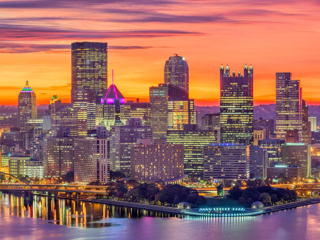 Pittsburgh, Pennsylvania, USA downtown skyline over the confluence of the three rivers at dawn.