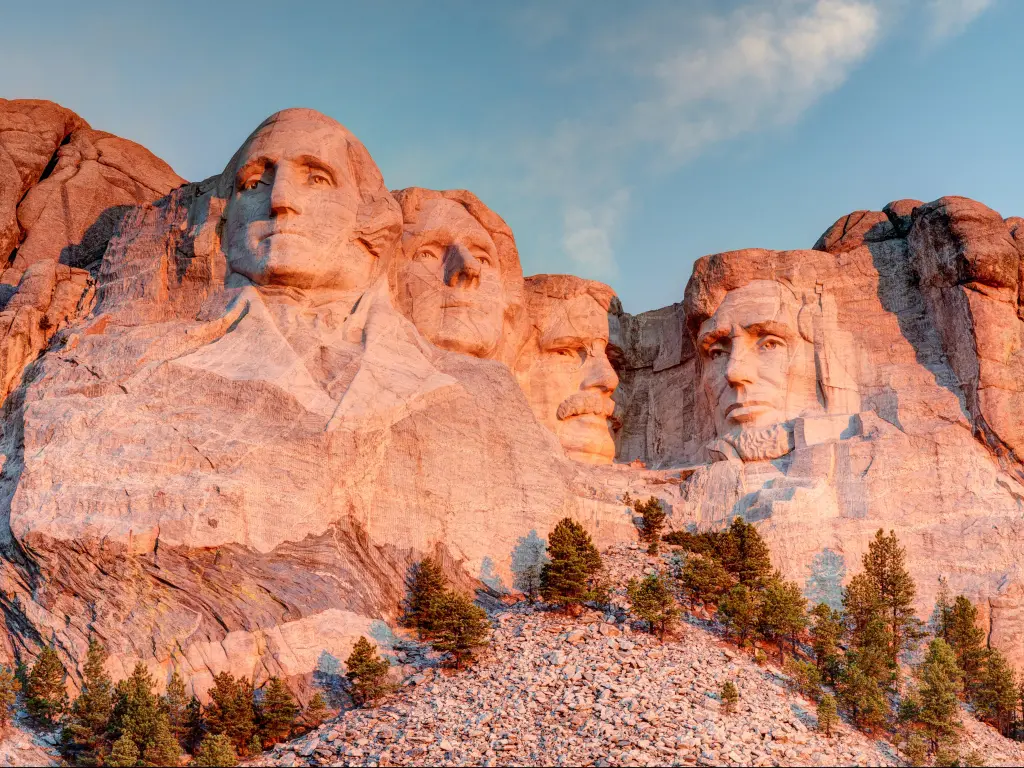 Mount Rushmore National Park in the Black Hills South Dakota during a warm sunrise with clear blue sky morning. 