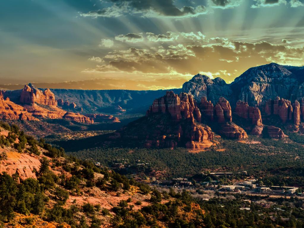 Wide rocky valley with mountains and vivid sunset light