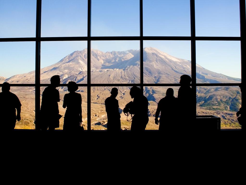 Tourists view Mt. Saint Helens through the windows of the Johnston Ridge Observatory. Washington Stat
