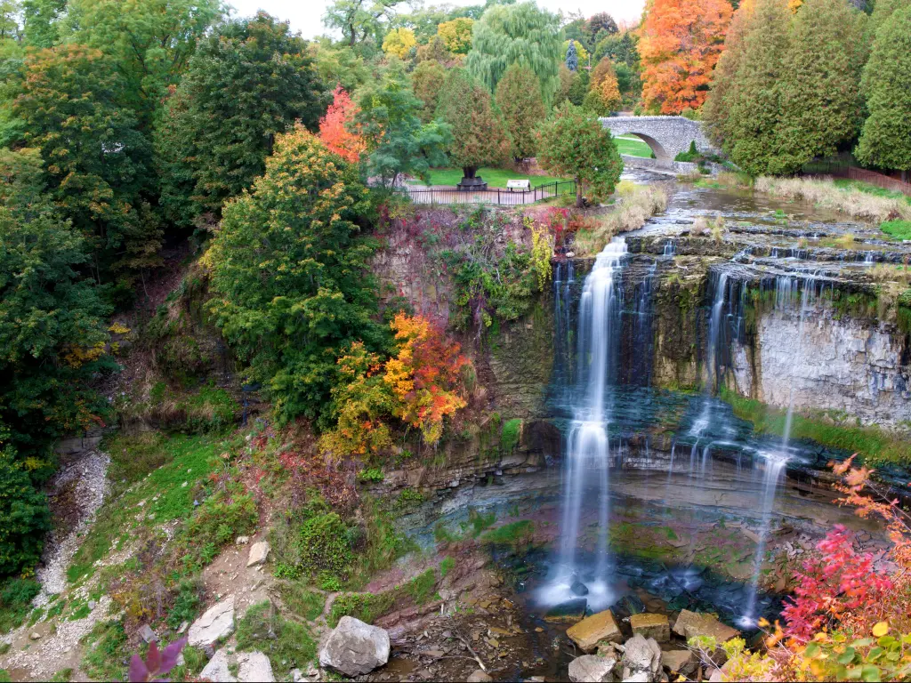 With a view of a beautiful waterfall in Hamilton, ON, Canada, in fall colors.