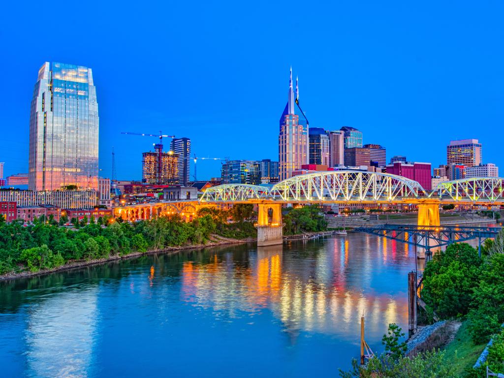 Nashville, Tennessee, USA with the downtown skyline at Shelby Street Bridge at night.