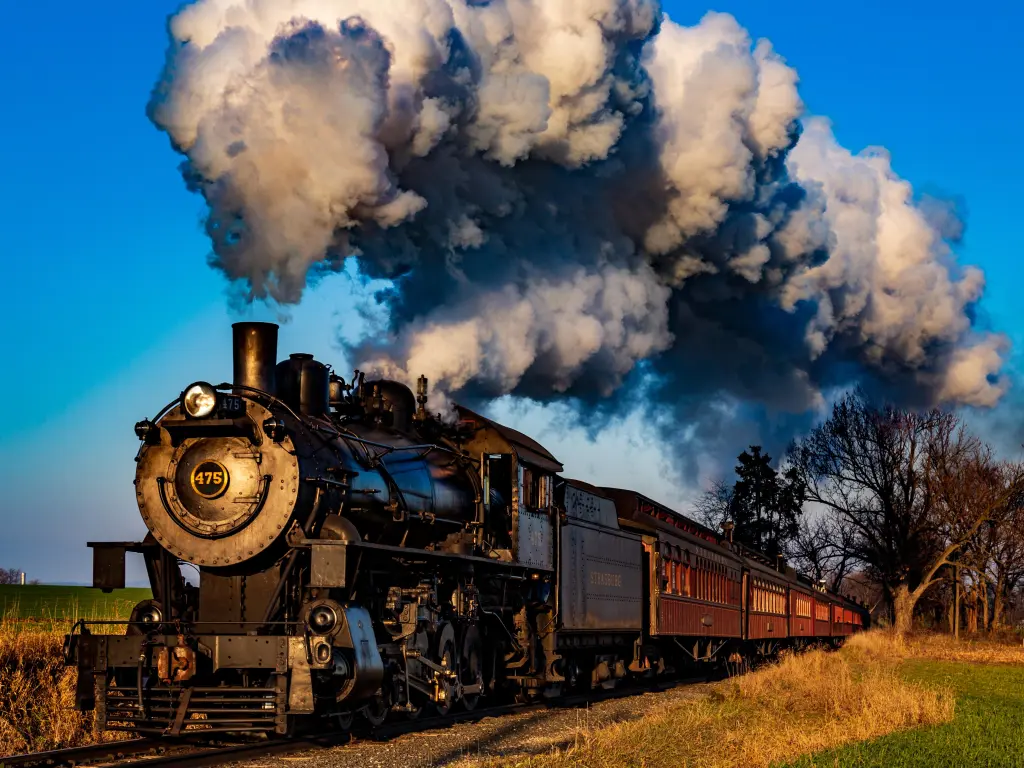  A Strasburg Rail Road steam locomotive pulls a passenger train on a sunny day