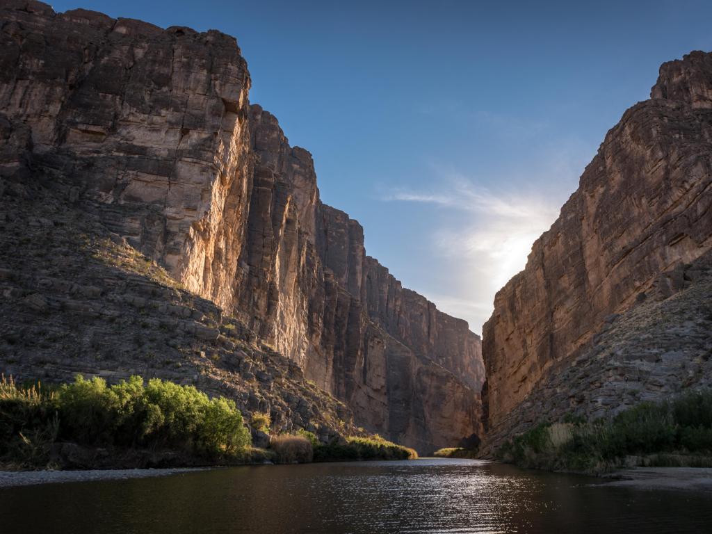 Santa Elena Canyon at Big Bend National Park, Texas, USA with the sunset behind the canyons in the distance. 
