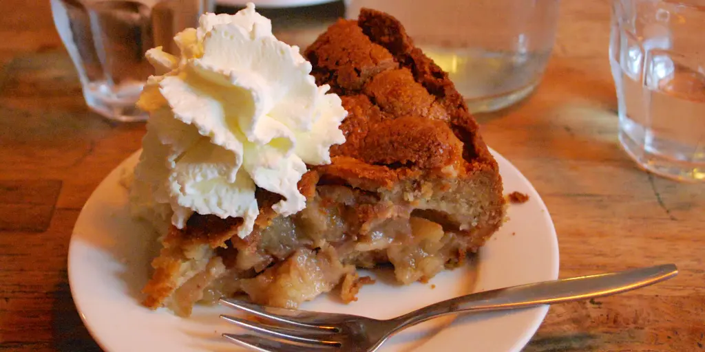 A slice of apple pie and whipped cream at Winkel 43 in Amsterdam 