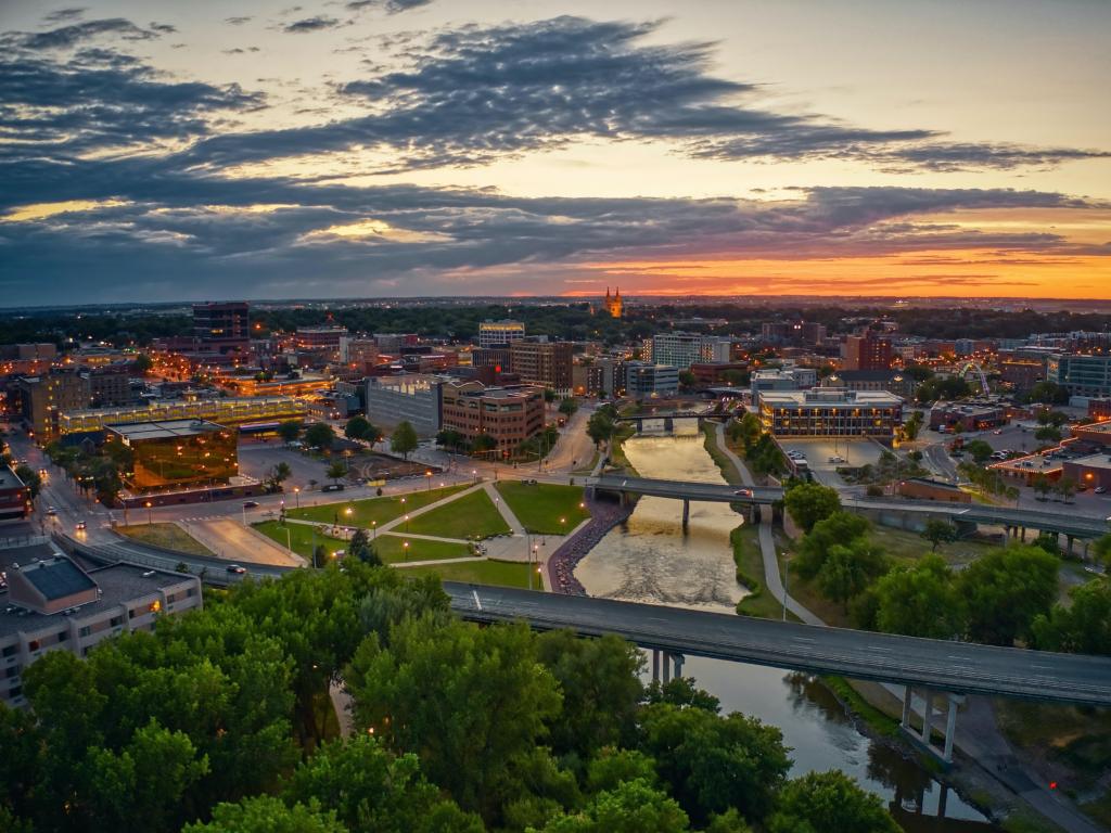 Sioux Falls, South Dakota, USA with an aerial view of Sioux Falls, South Dakota at sunset.