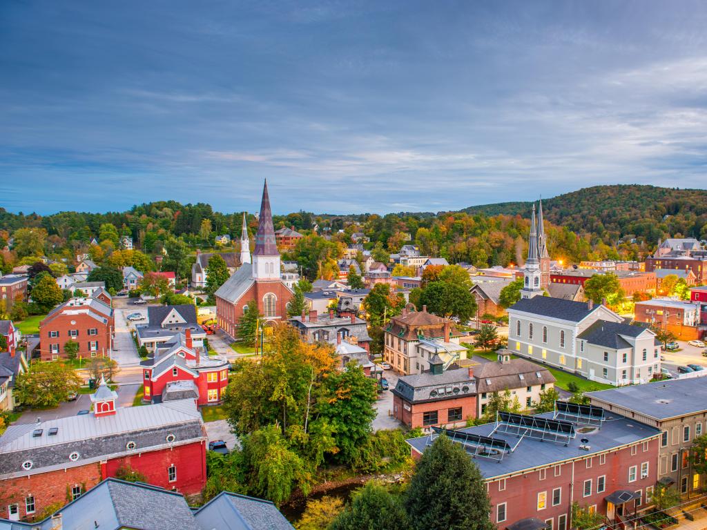Montpelier, Vermont, USA with the town skyline taken at early evening, with trees dotted and hills in the background. 