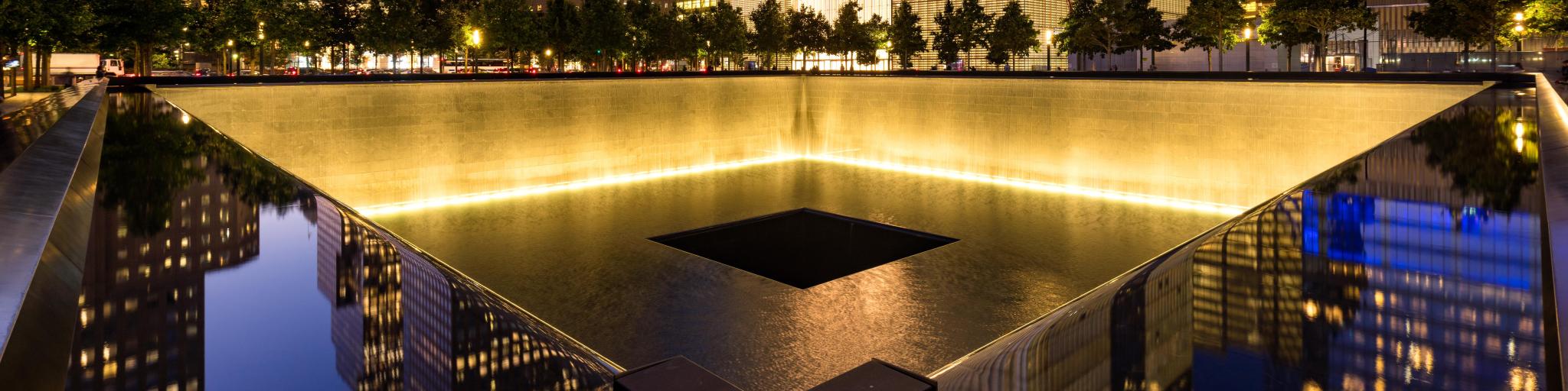The North Reflecting Pool at the 911 Memorial at twilight