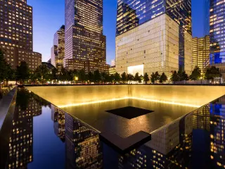 The North Reflecting Pool at the 911 Memorial at twilight