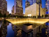The North Reflecting Pool at the 911 Memorial at twilight