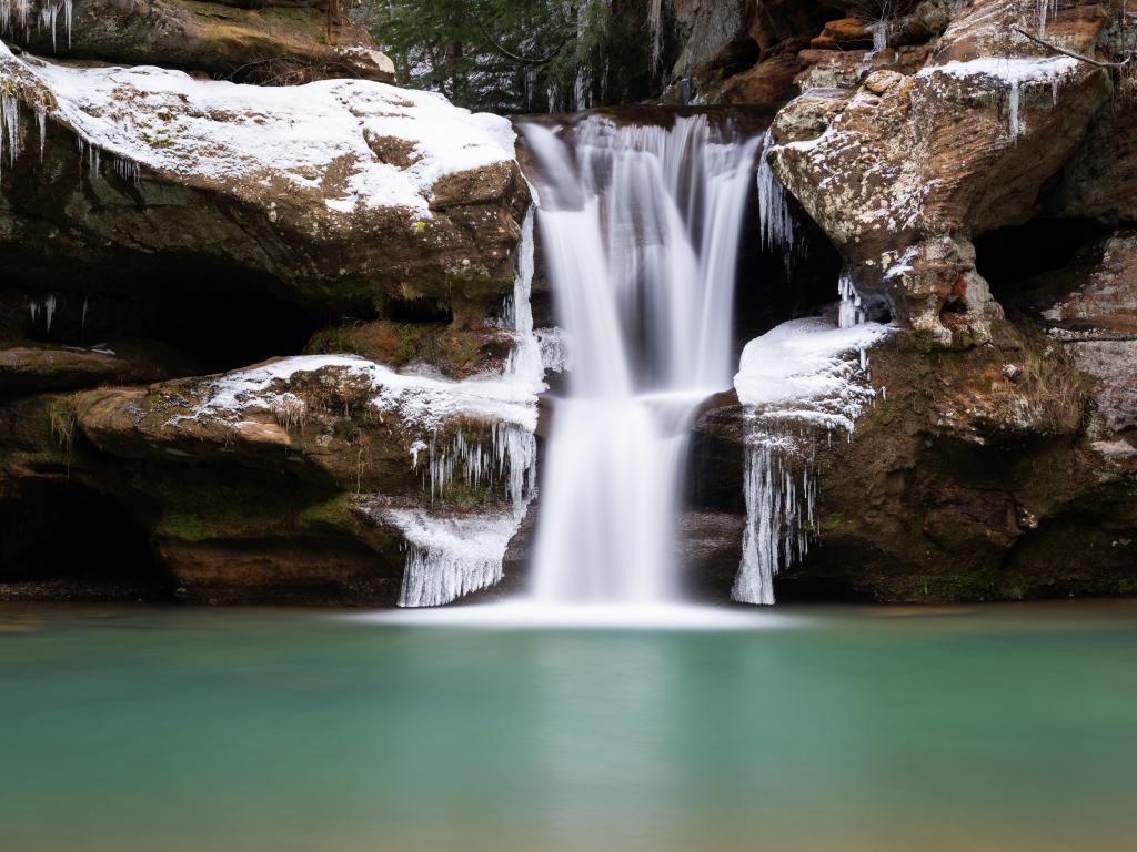 Wayne National Forest, Ohio, USA taken at Upper Falls with a waterfall in icy winter conditions in the Appalachian Mountain Region.
