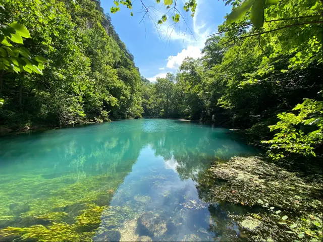 Crystal clear spring water at Ha Ha Tonka State Park, MO, USA on a sunny day.