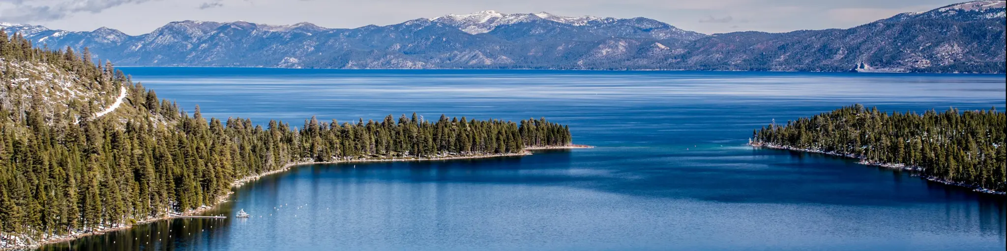 View of Lake Tahoe from near Emerald Bay, California, USA, including Fannette Island, in the end of the winter of 2018, covered with a very shallow layer of snow.