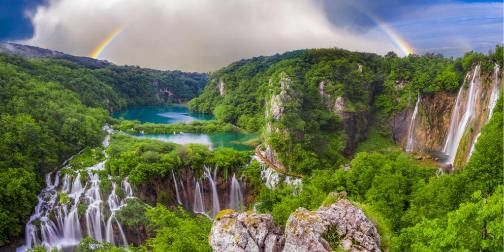 A rainbow over the stunning waterfalls of Plitvice Lakes in Croatia