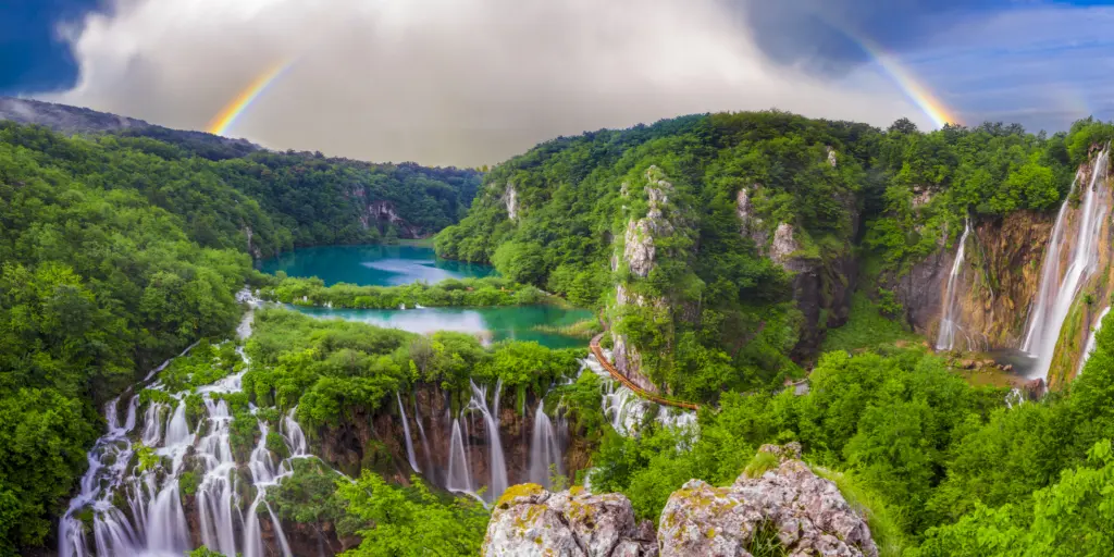 A rainbow over the stunning waterfalls of Plitvice Lakes in Croatia