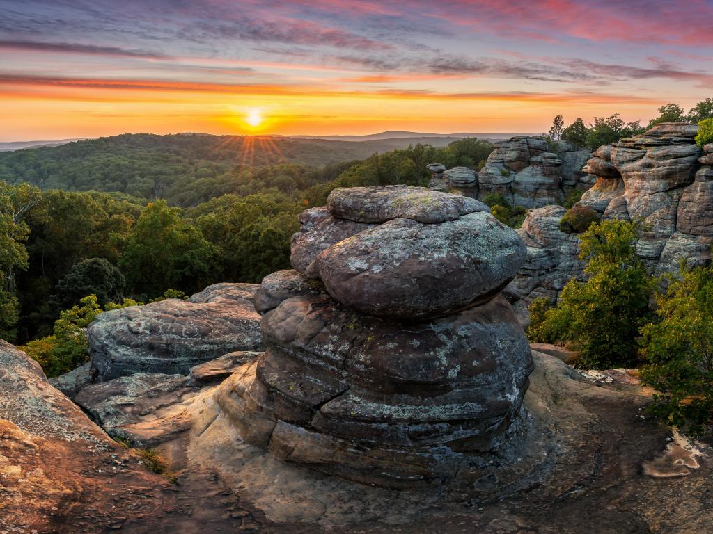 Shawnee National Forest, USA taken during a beautiful, colorful sunset over the sandstone hoodoo's at the Garden of the Gods with trees in the distance,