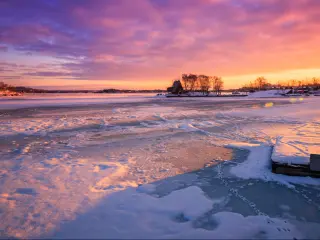 Frozen lake in Ontario at sunset 