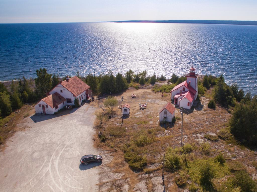 The Mississagi Lighthouse on Manitoulin Island with Cockburn Island in the background in Ontario, Canada.