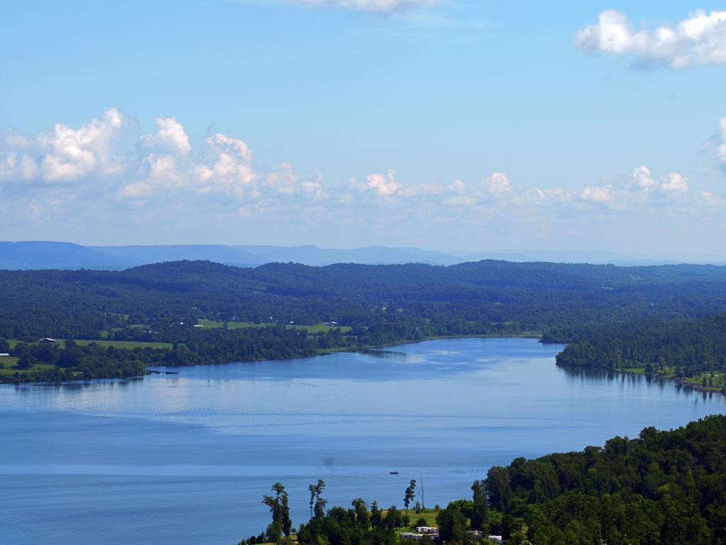 Scenic view of Lake Guntersville State Park from a high vista with blue skies and fluffy clouds