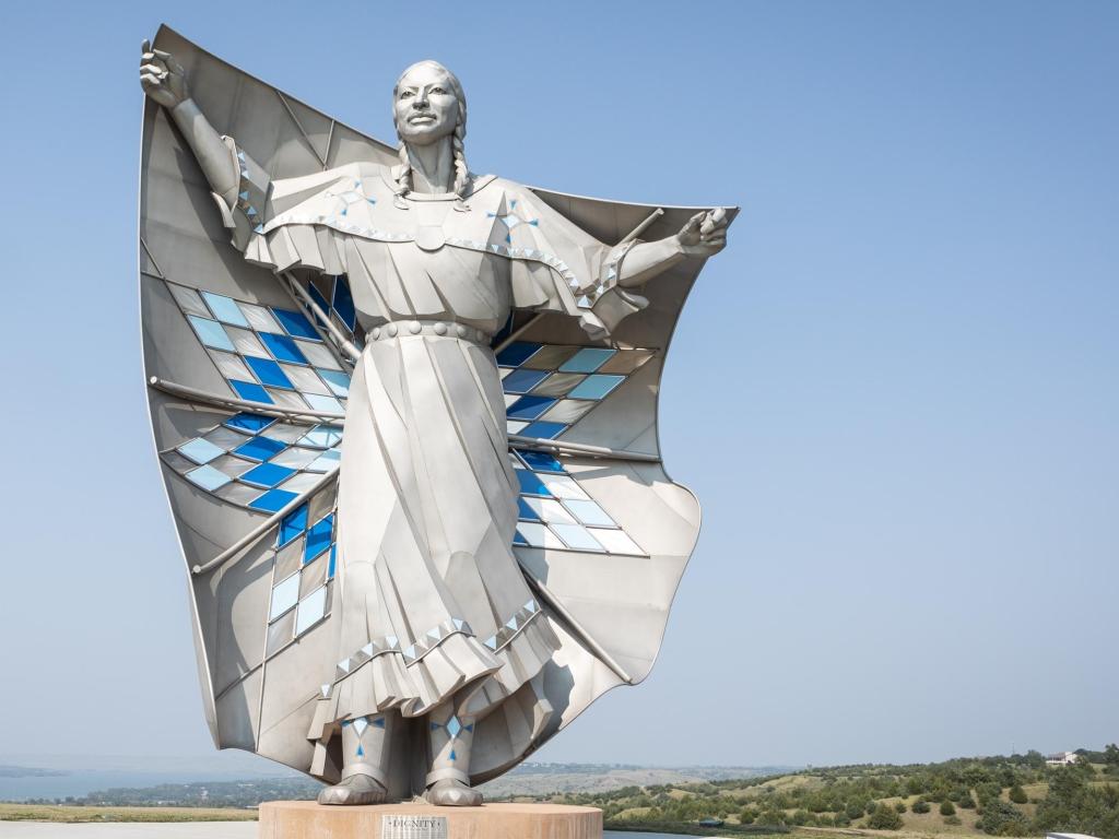 Dignity Statue stands tall against a blue sky in Chamberlain, South Dakota