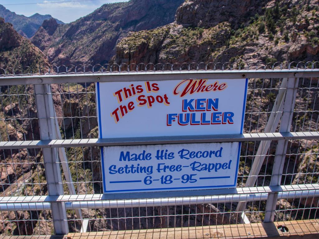 Sign displayed on the Royal Gorge Bridge commemorating a record-breaking rappel in Colorado, USA