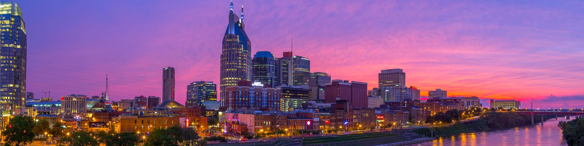 Nashville, Tennessee, USA skyline taken at early evening with pink skies.