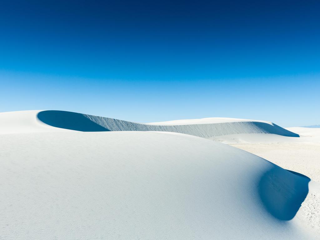 Graphical lines at White Sand Dunes National Monument, New Mexico, USA, photo taken on a sunny day with no clouds in the sky.
