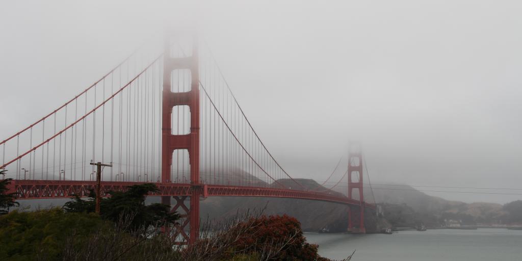 June Gloom in San Francisco with heavy fog setting on the city's Golden Gate Bridge