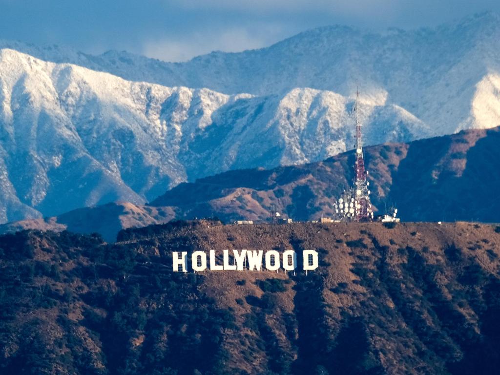 The Hollywood Sign, Los Angeles, in the winter, with mountains dusted with snow in the background