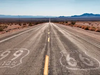 Route 66 road through the Californian desert on the way to Joshua Tree National Park