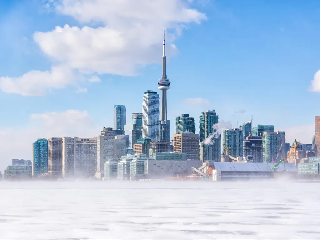 High rise buildings of Toronto skyline viewed across frozen Lake Ontario