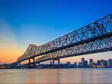New Orleans, Louisiana, USA with the Crescent City Connection Bridge on the Mississippi river and downtown New Orleans Louisiana taken at sunset. 