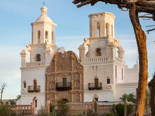 Ornate facade of the San Xavier Del Bac Mission in Tucson, Arizona on a clear sunny day