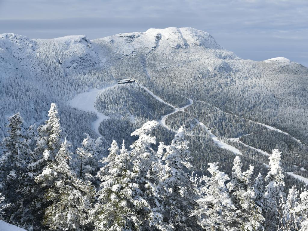 Stowe Ski Resort in Vermont, USA, with a view to the Mansfield mountain slopes, with fresh snow on trees early season.