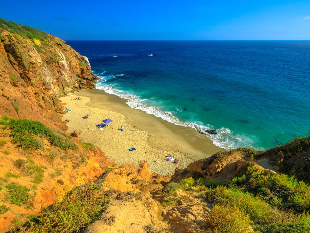 Aerial view of Pirates Cove, a hidden sandy beach in a small cove on west side of Point Dume, Malibu coast in California Blue sky, sunny day