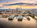 Aerial panorama with Ben Franklin Bridge and Philadelphia skyline at sunset. 