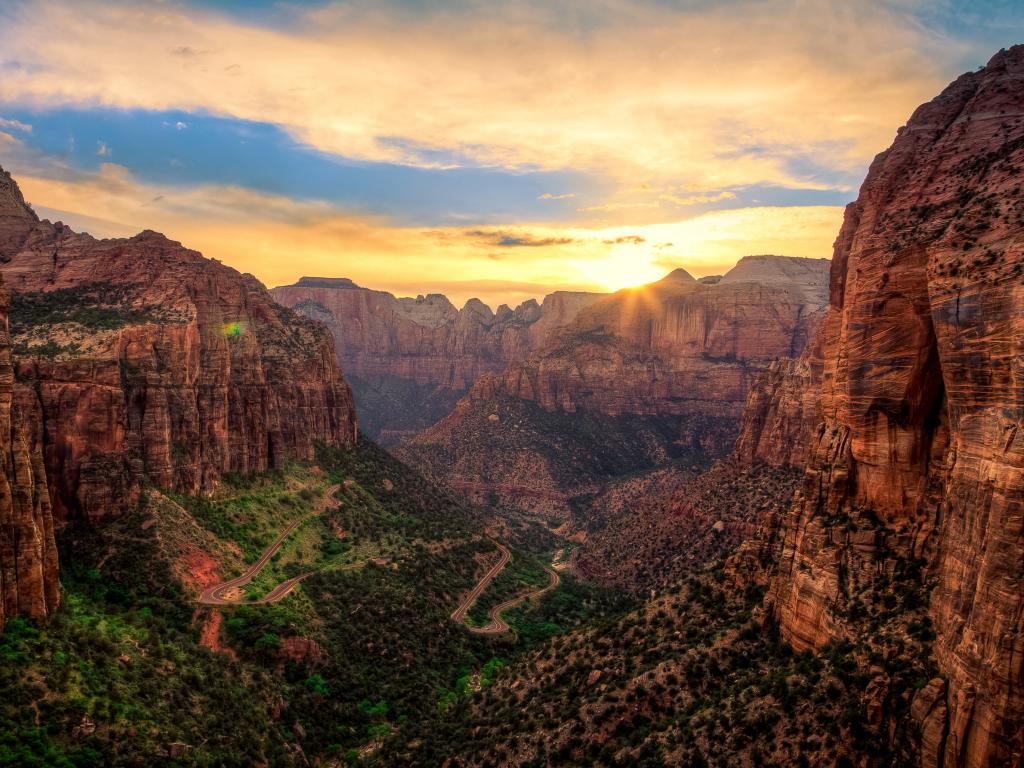 The golden sunset is cascading over the Zion Canyon in Zion National Park, Utah.