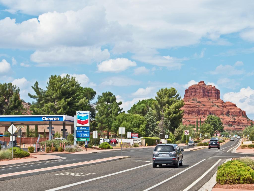 Oak Creek Village along route 179 towards Sedona on a sunny morning with Bell Rock in the background.