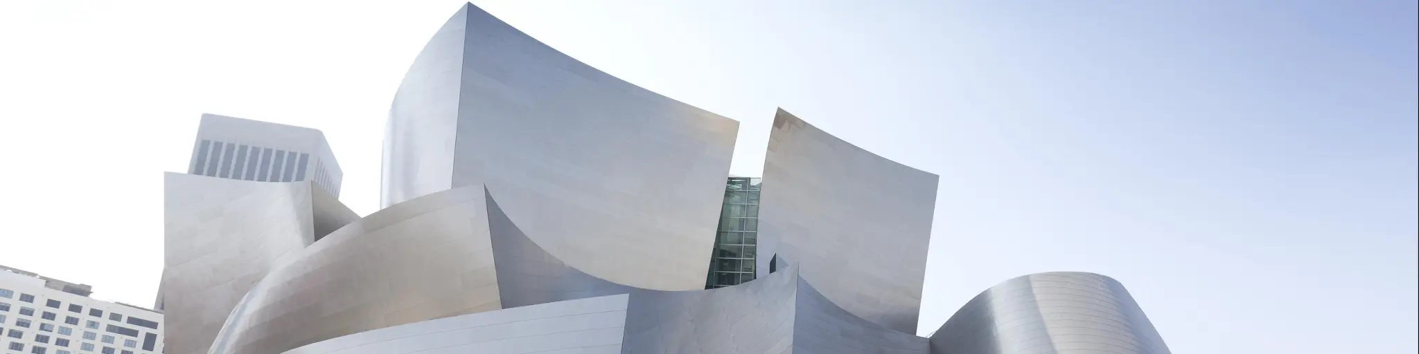 Walt Disney Concert Hall is designed by Frank Gehry and is the home of the Los Angeles Philharmonic orchestra. Photo taken on a bright day.