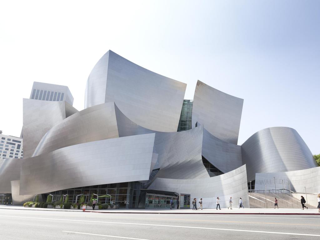 Walt Disney Concert Hall is designed by Frank Gehry and is the home of the Los Angeles Philharmonic orchestra. Photo taken on a bright day.