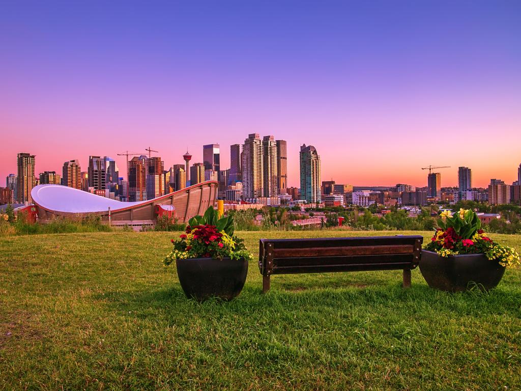 A colorful sunrise sky over downtown Calgary in the summer