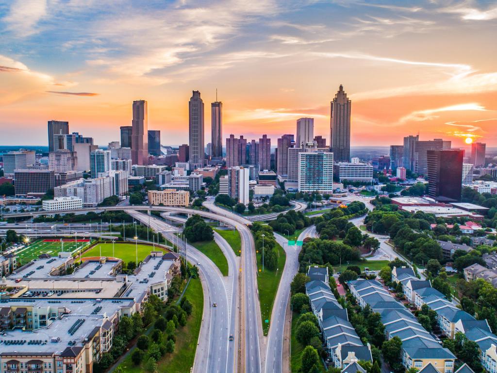 Atlanta, Georgia, USA with a panorama of the downtown skyline at sunset.