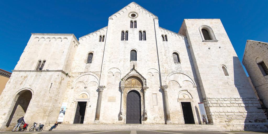 The outside of the Basilica di San Nicola, Bari against a blue sky 